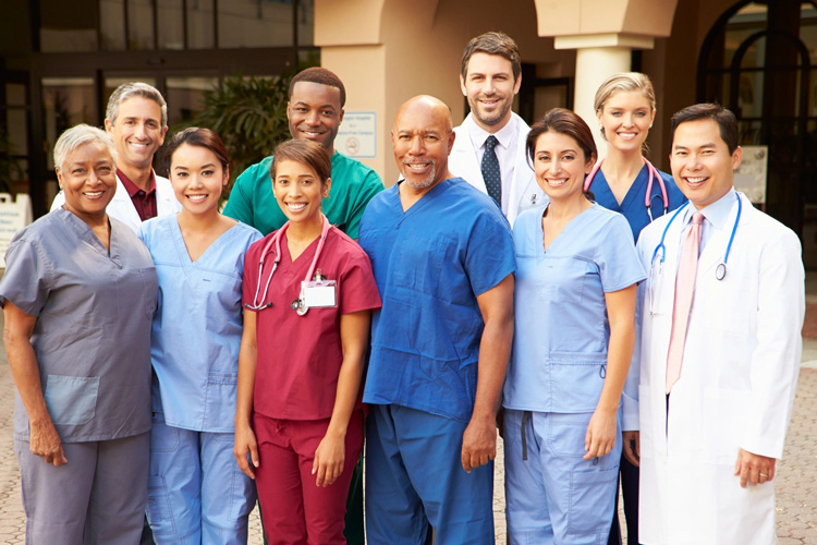 A group of doctors and nurses standing together.