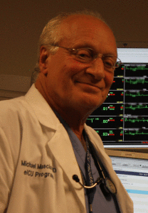 A man in white lab coat and glasses.